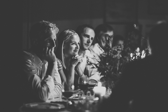 wedding guests sitting around cottage table