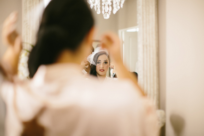 bride putting on her veil