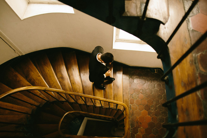 groom walking down stairs