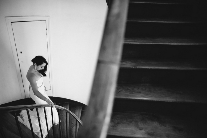 bride walking down spiral stairway