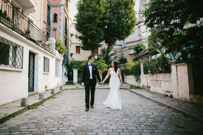 bride and groom walking in paris