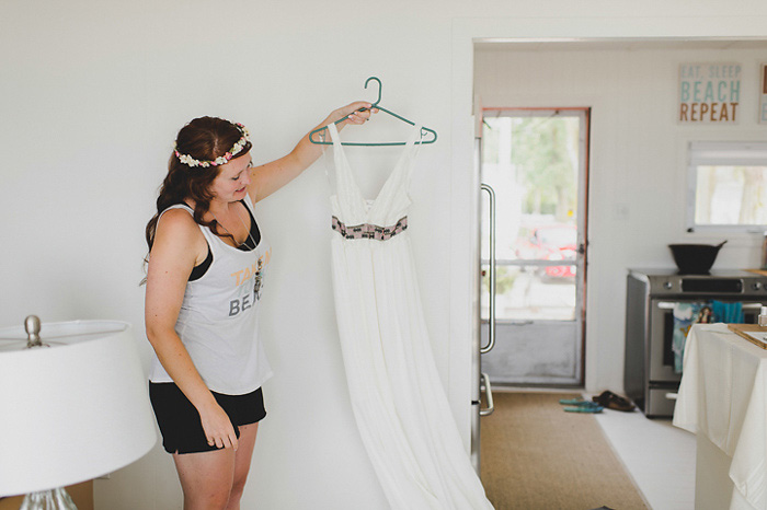 bride holding her wedding dress