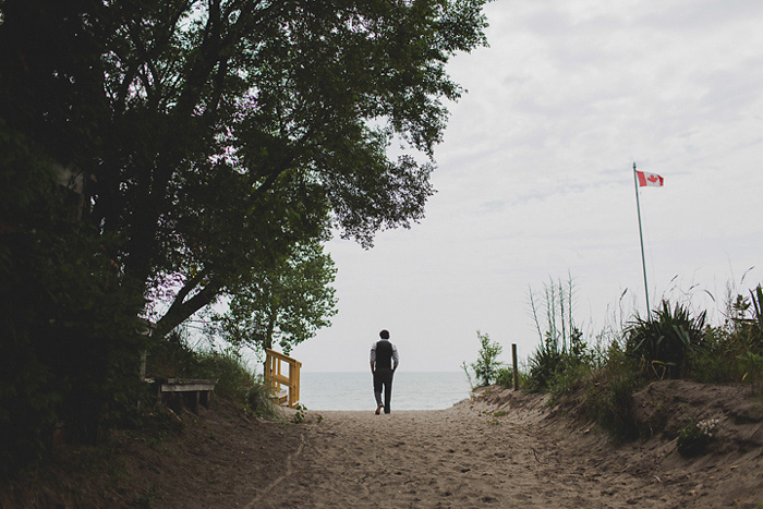 groom walking down to beach