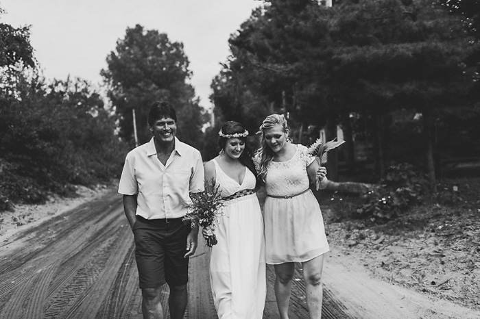 bride walking with her father and maid of honor