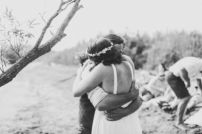 bride and groom hugging at ceremony