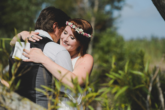 bride and groom hugging at wedding ceremony