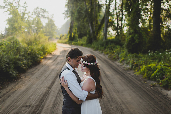 bride and groom on cottage road