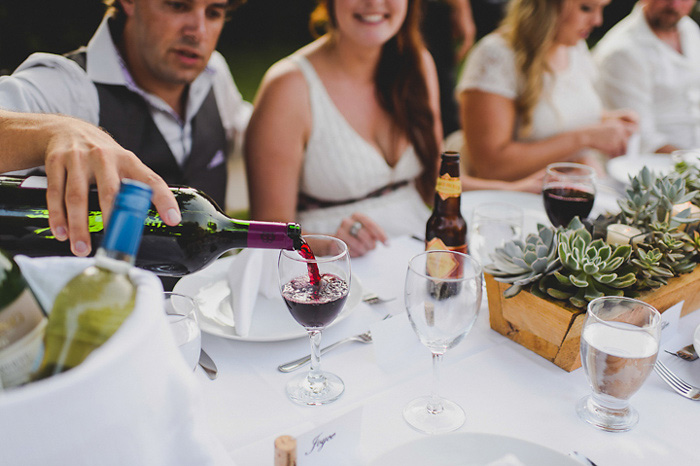 groom pouring wine