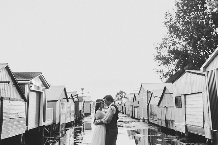 bride and groom portraits by boathouses