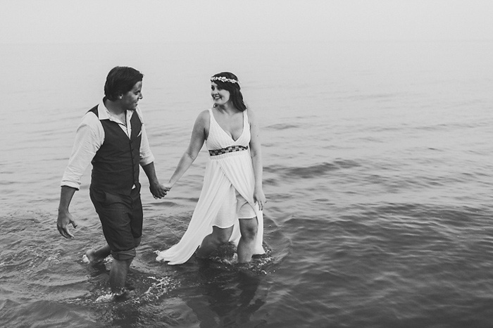 bride and groom walking in the water