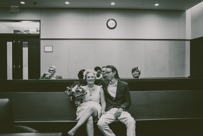 bride and groom waiting at courthouse