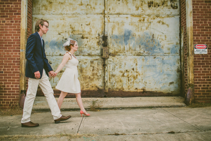 bride and groom walking through the city