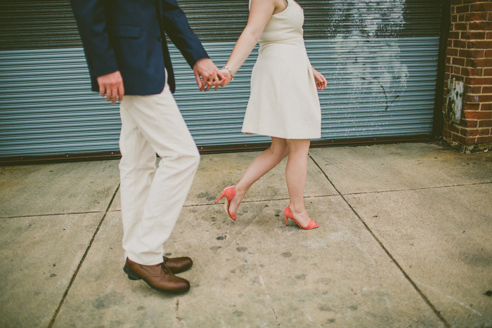 bride and groom walking through raleigh