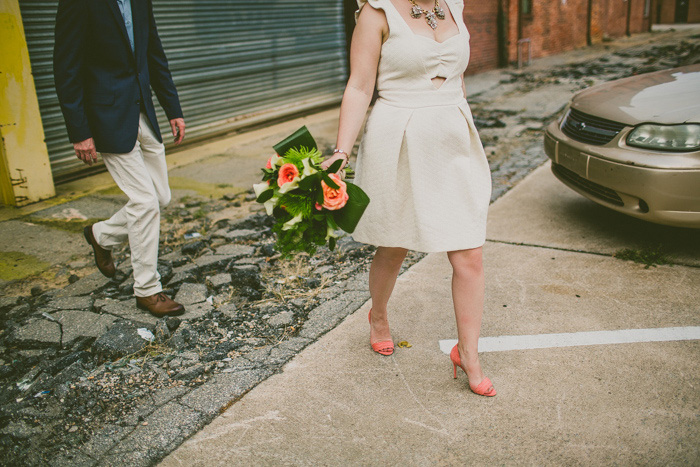 bride and groom walking through the city