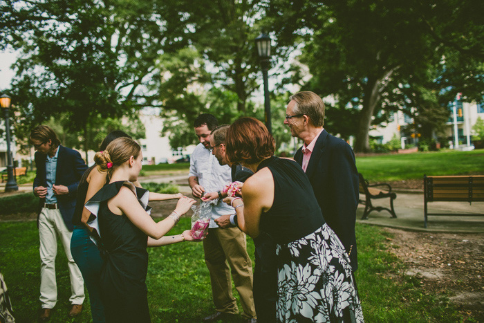 wedding guests with rose petals