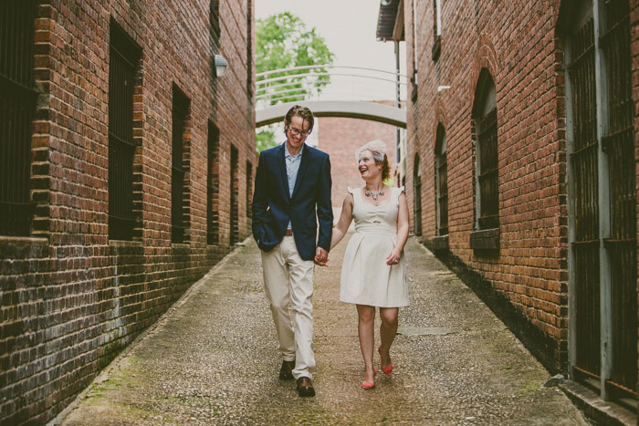 bride and groom walking through Raleigh