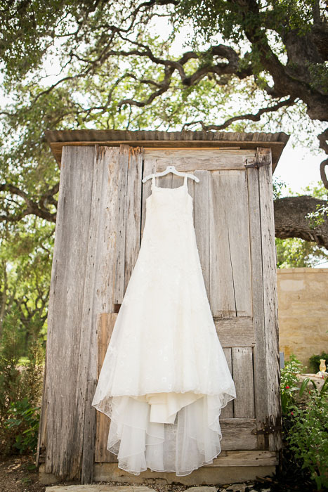 wedding dress hanging up outdoors