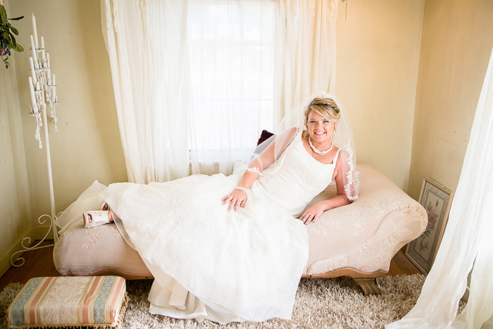 bride lounging on chaise