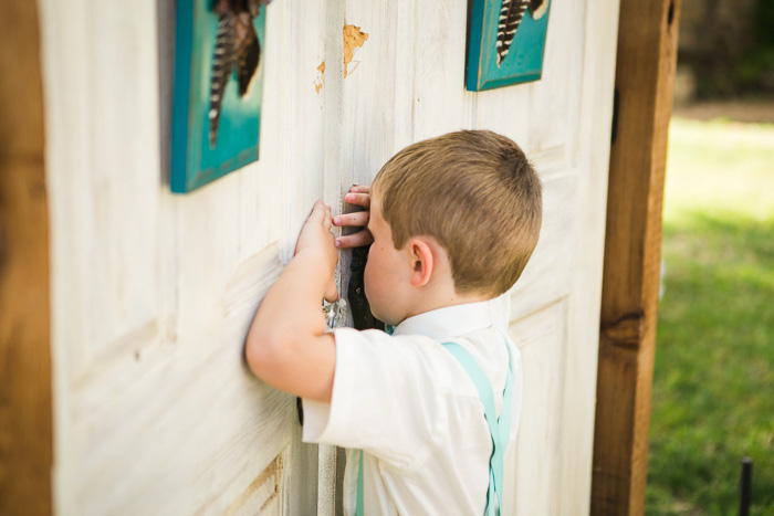 ring bearer peeking through doors