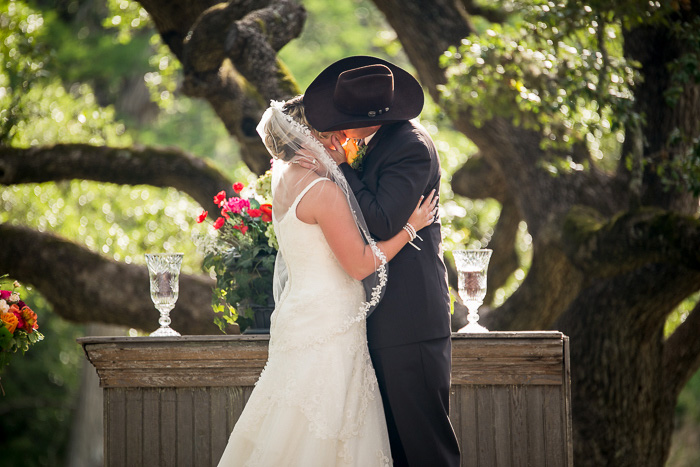 bride and groom first kiss