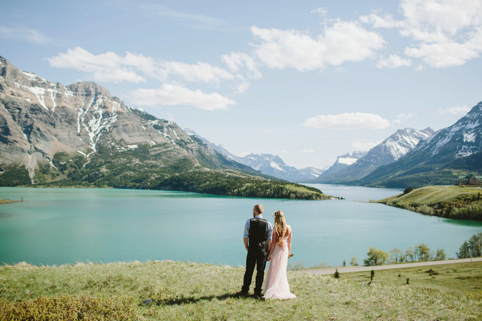 bride and groom portrait by turquoise lake