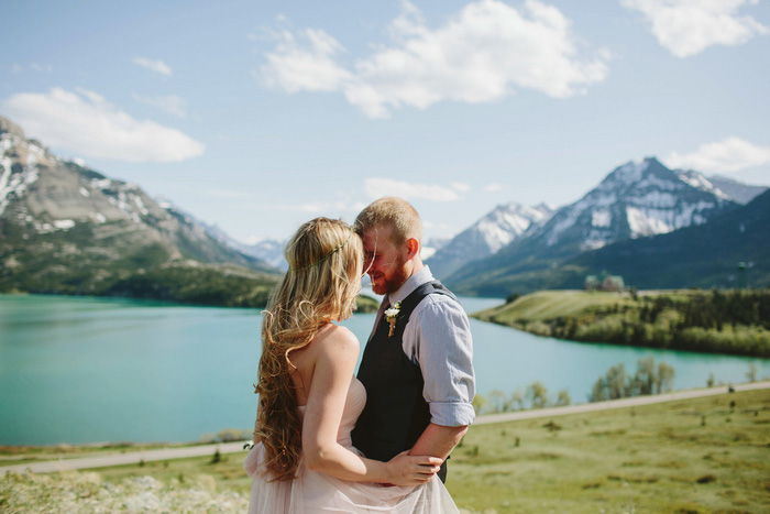 bride and groom by Alberta lake