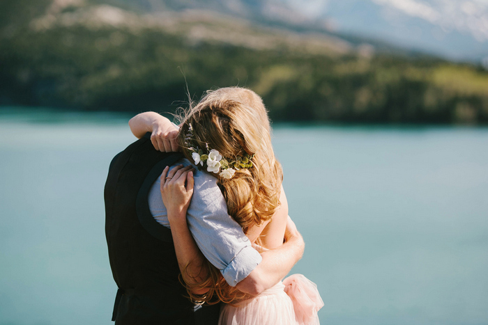 bride and groom hugging