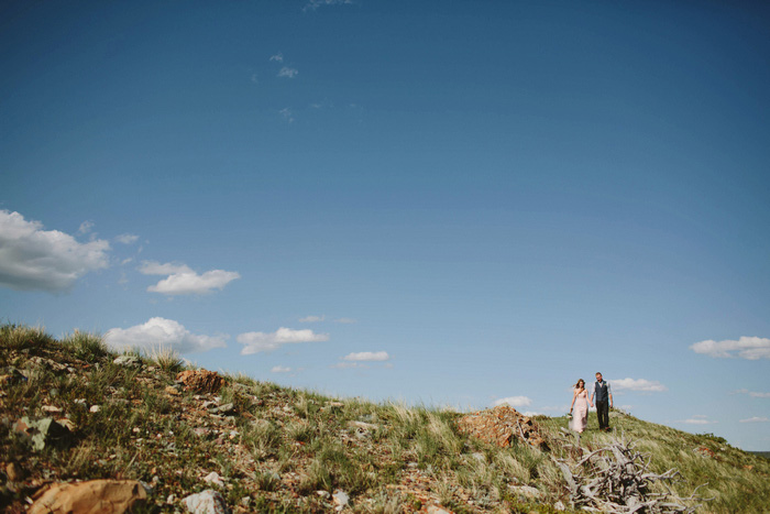 bride and groom in the ountains