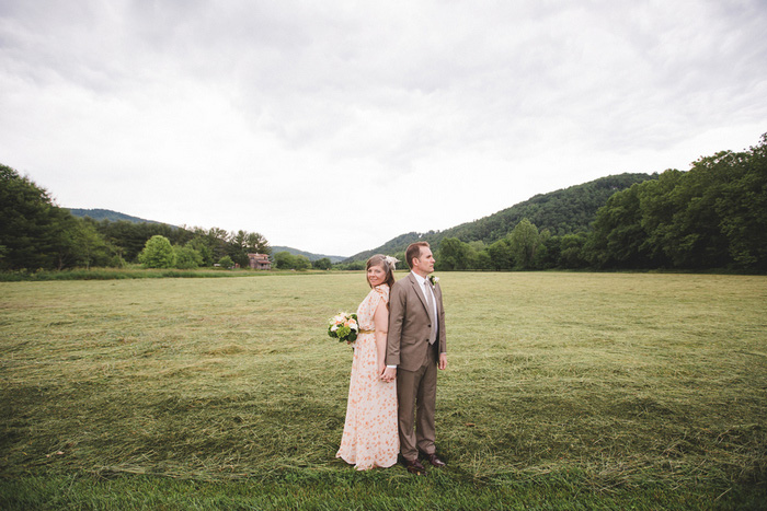 bride and groom portrait in field