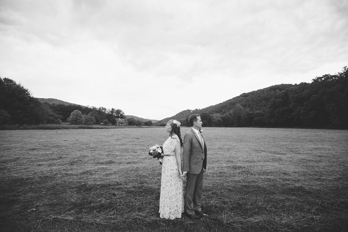 bride and groom portrait in field