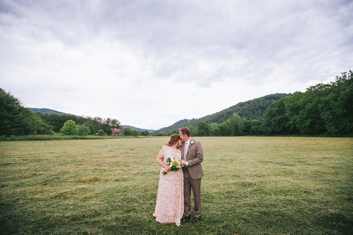 bride and groom in field