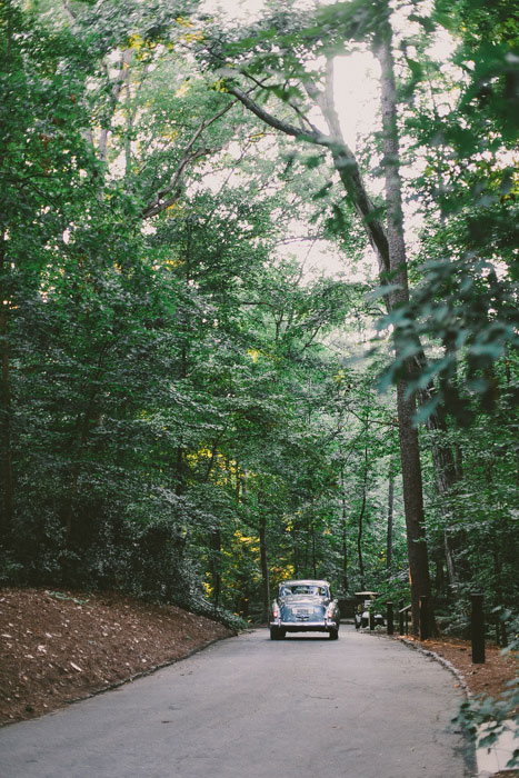 bride and groom driving off