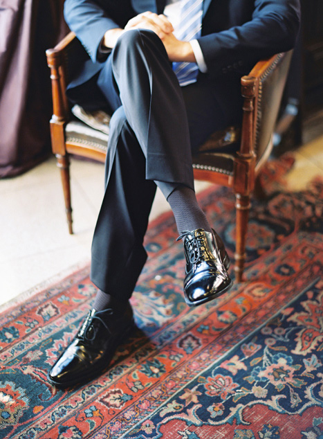 groom sitting in chair