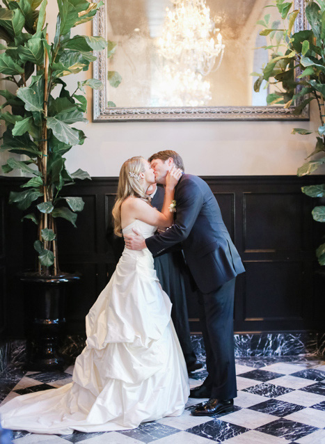 bride and groom first kiss