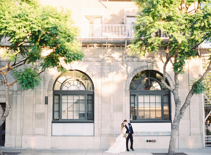 bride and groom walking down street