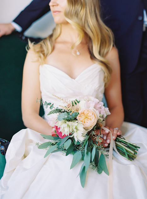 bridal bouquet on bride's lap