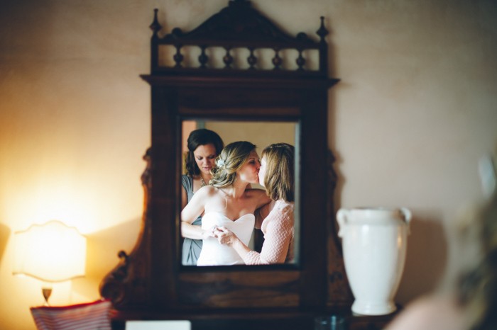 bride kissing her bridesmaid