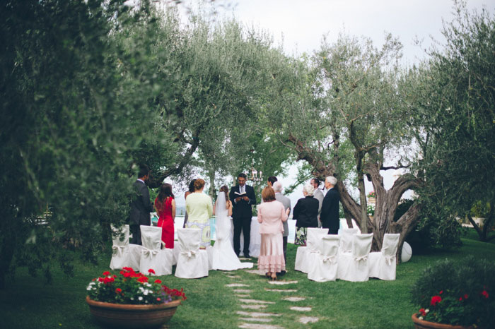 back of the bride walking down the aisle