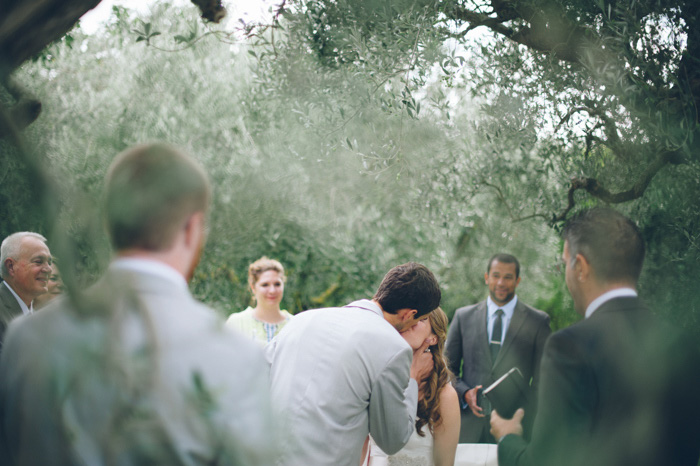 bride and groom first kiss