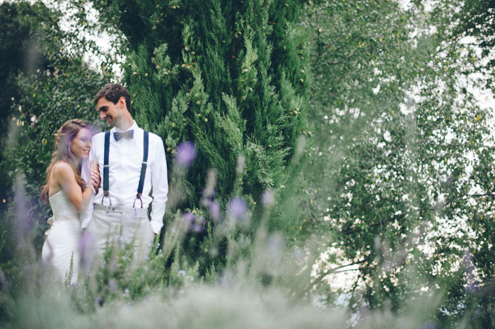 bride and groom in field