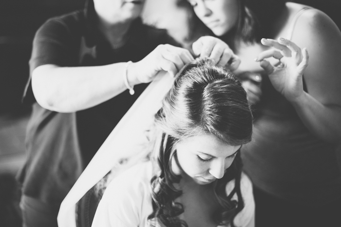 bride putting on her veil