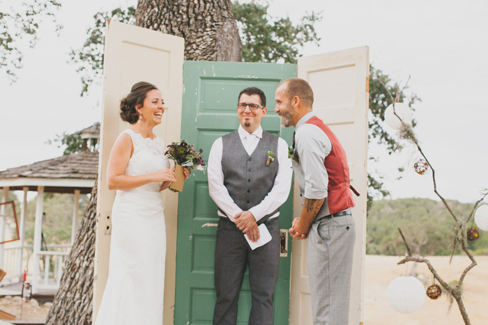 bride and groom laughing during ceremony