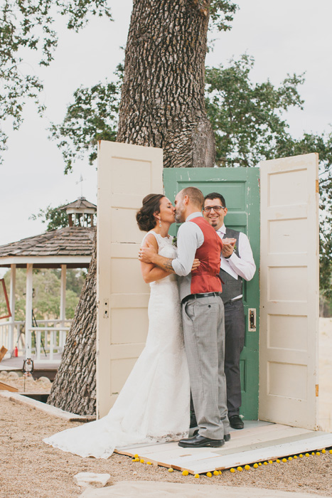 bride and groom first kiss