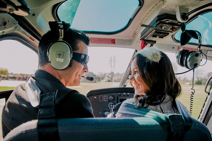 bride and groom in helicopter