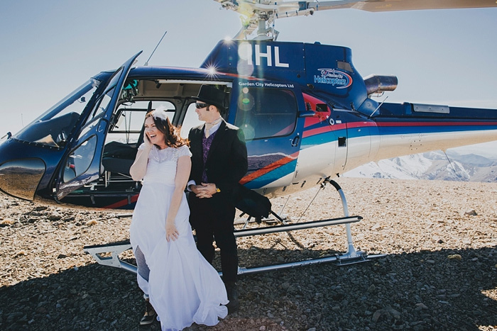 bride and groom exiting helicopter