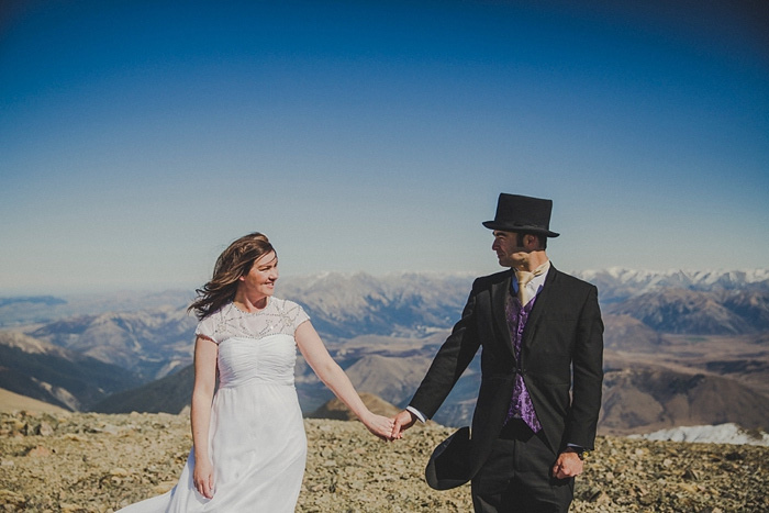 bride and groom on mountain