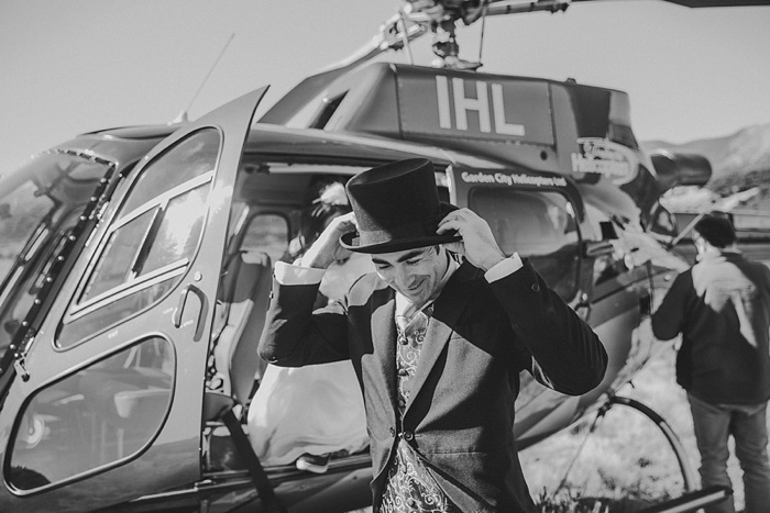 groom adjusting top hat