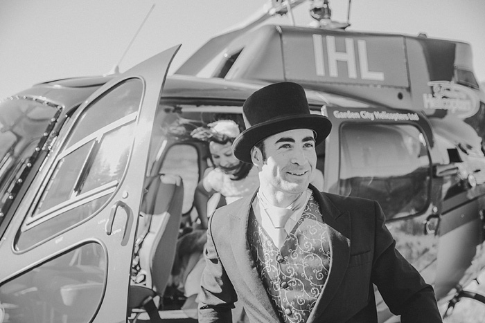 groom in top hat exiting helicopter