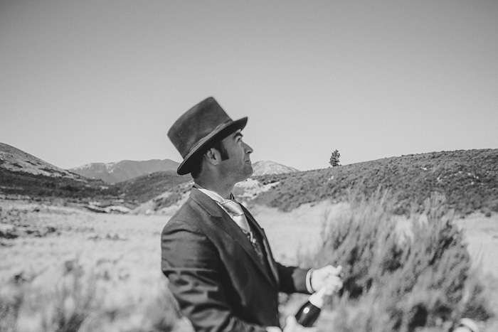 groom popping champagne