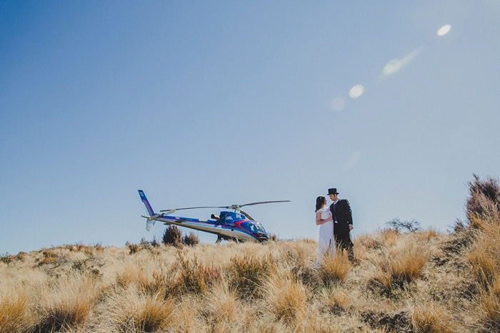 bride and groom by helicopter